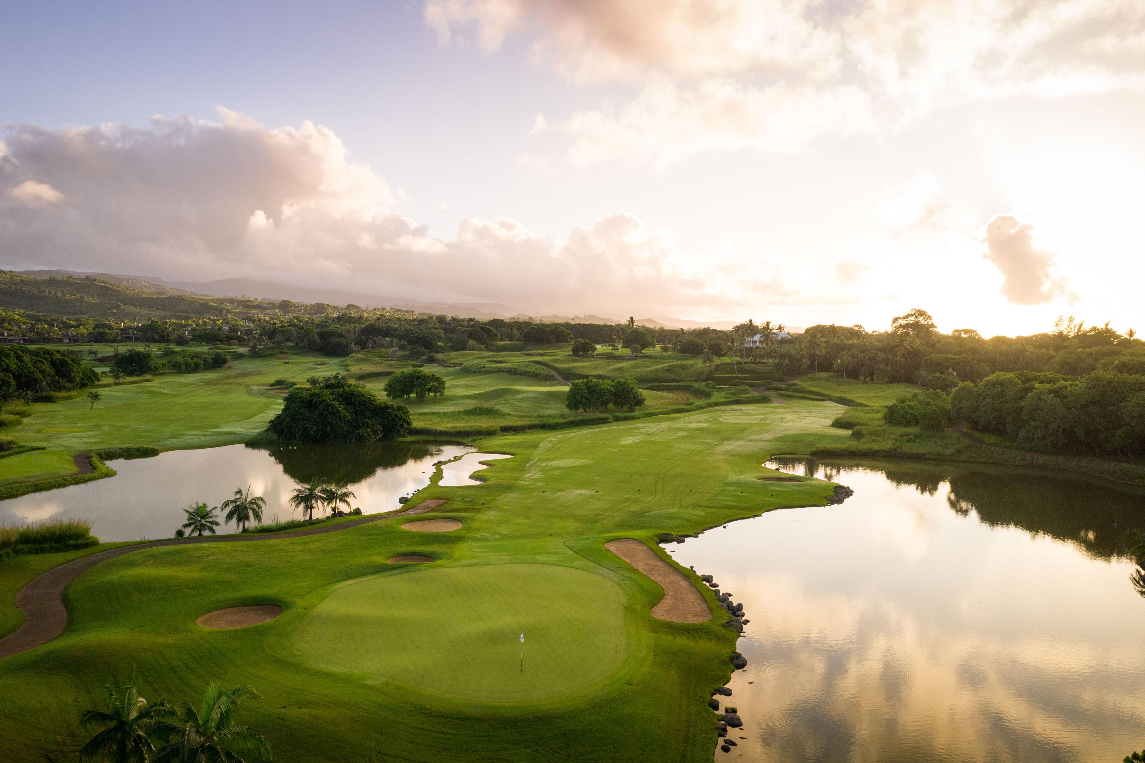 A well maintained fairway leading to a smooth green