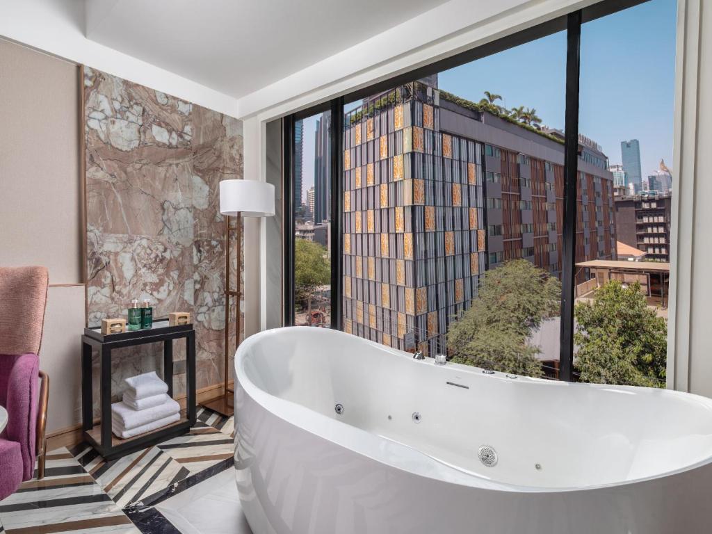 Bathroom as part of a double bed suite at pipa hotel bangkok