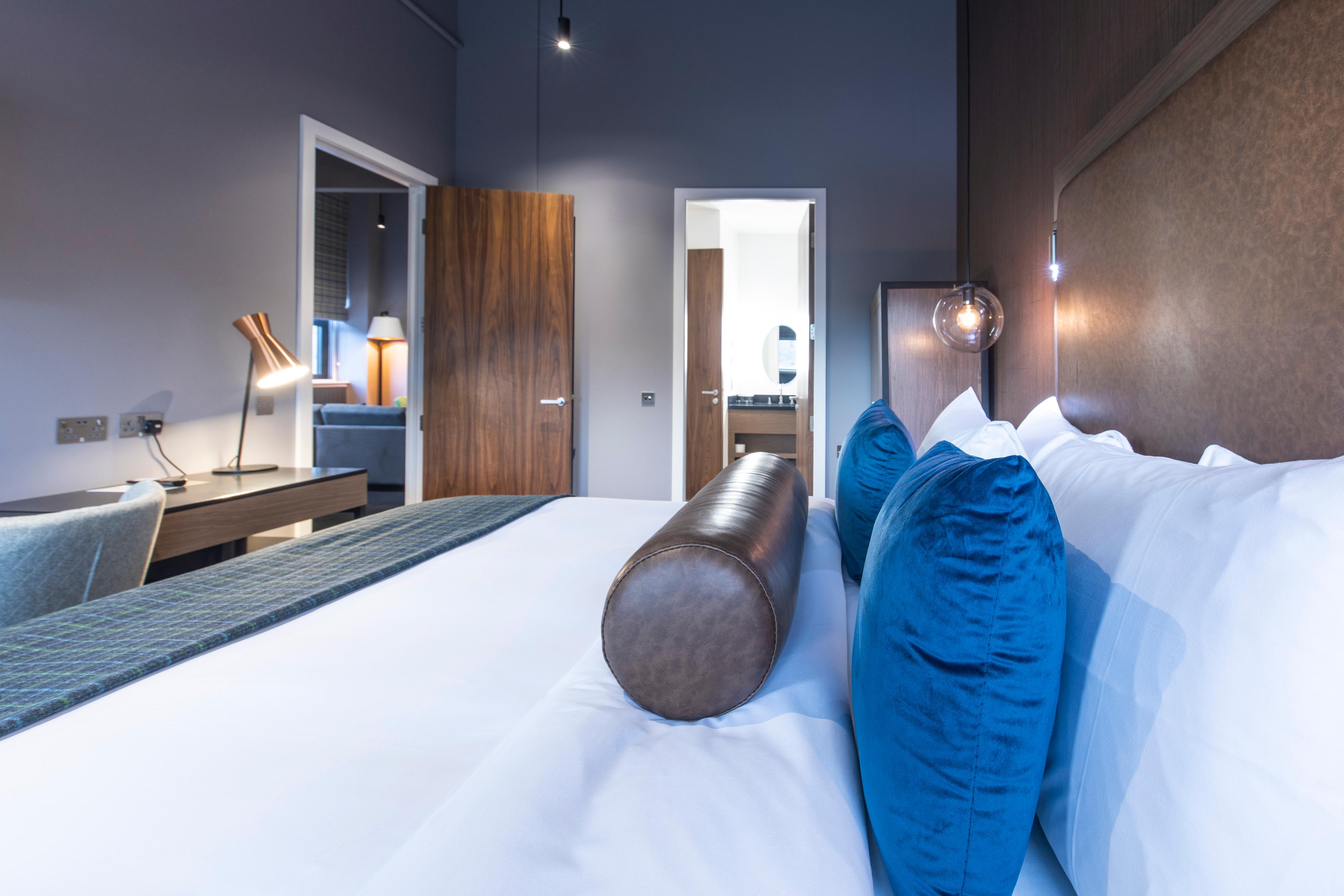 Bed room as part of a suite at The Sandman