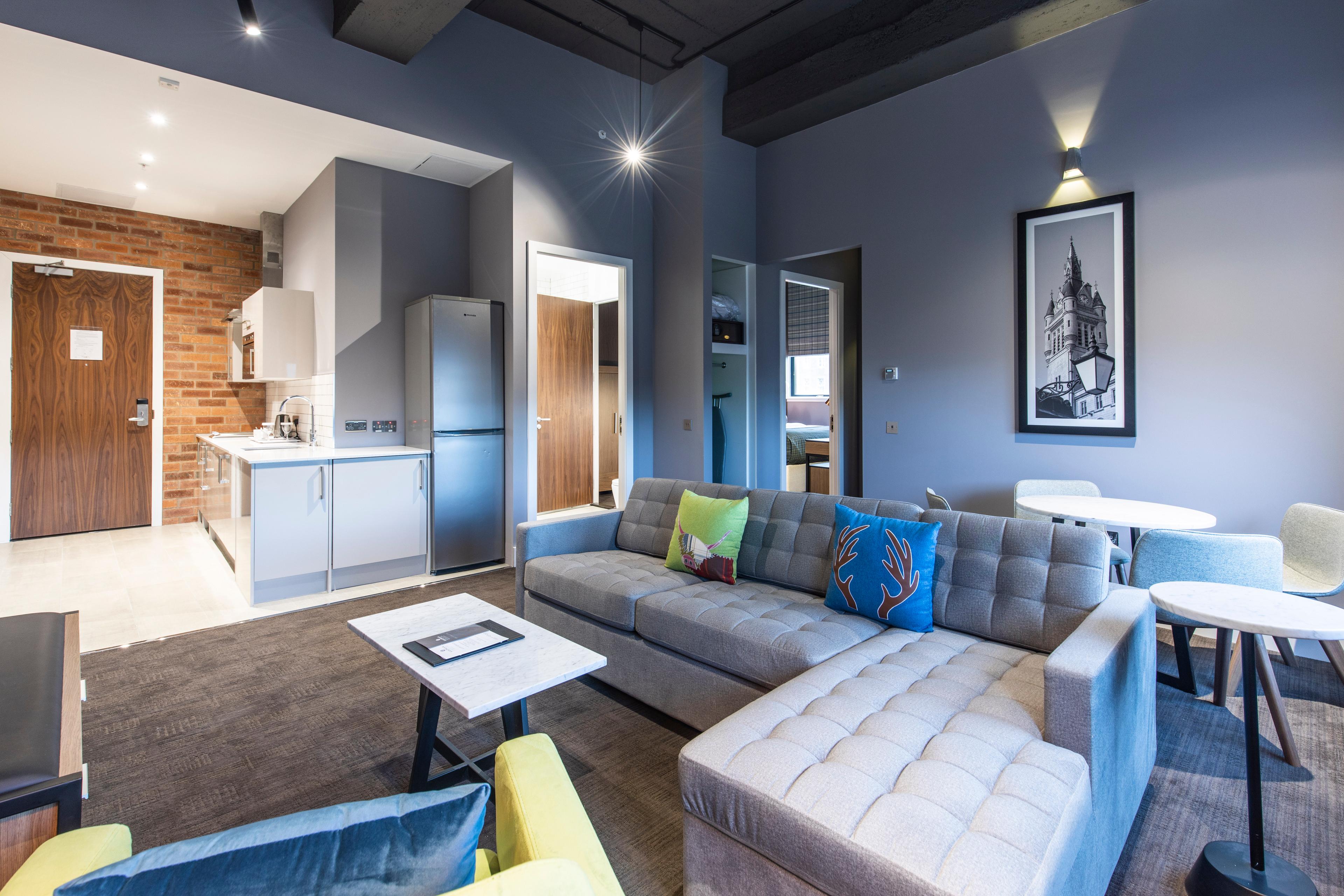 Living room and kitchen as part of a double bed suite at The Sandman