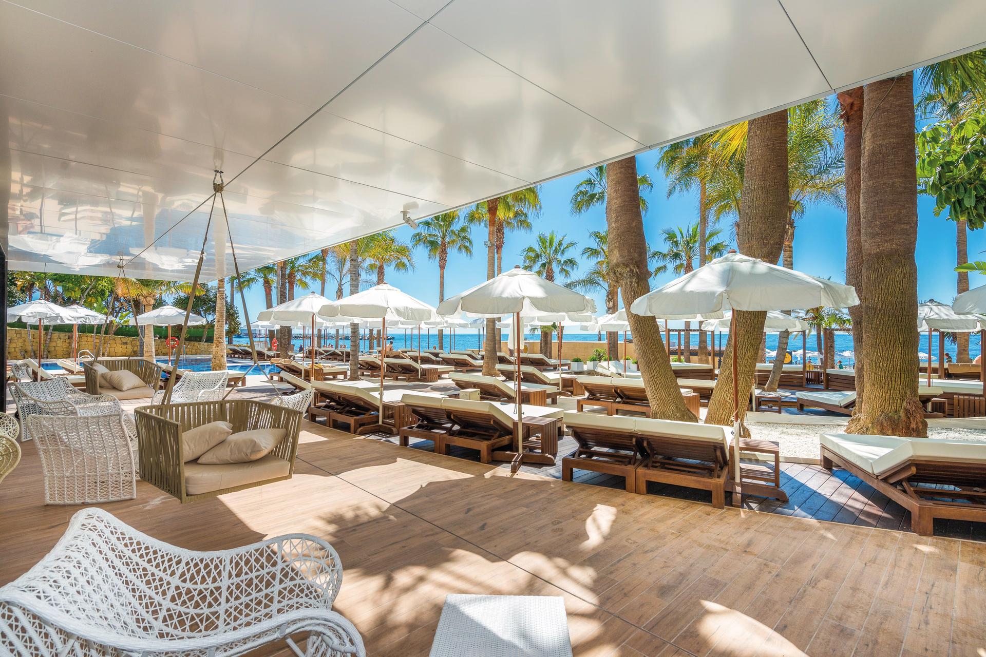 Outdoor lounging area at Amàre Beach Hotel Marbella