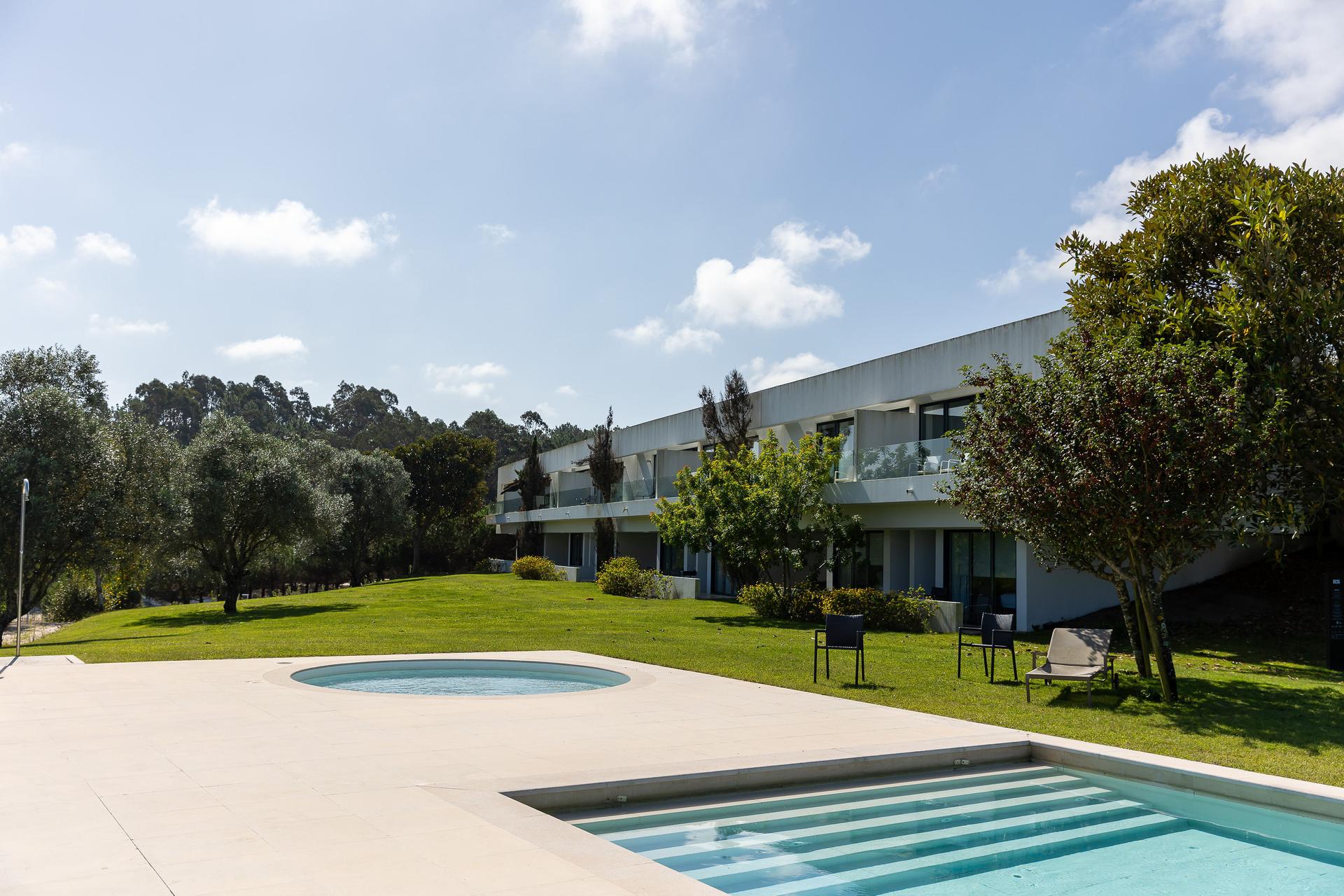 Panoramic view of a villa overlooking the outdoor pool at Bom Sucesso Resort