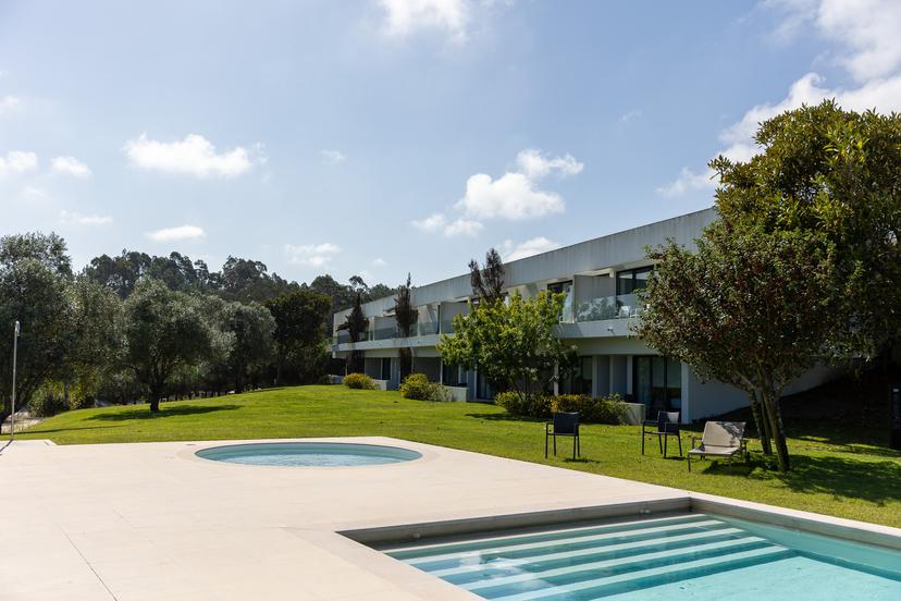 Panoramic view of a villa overlooking the outdoor pool at Bom Sucesso Resort