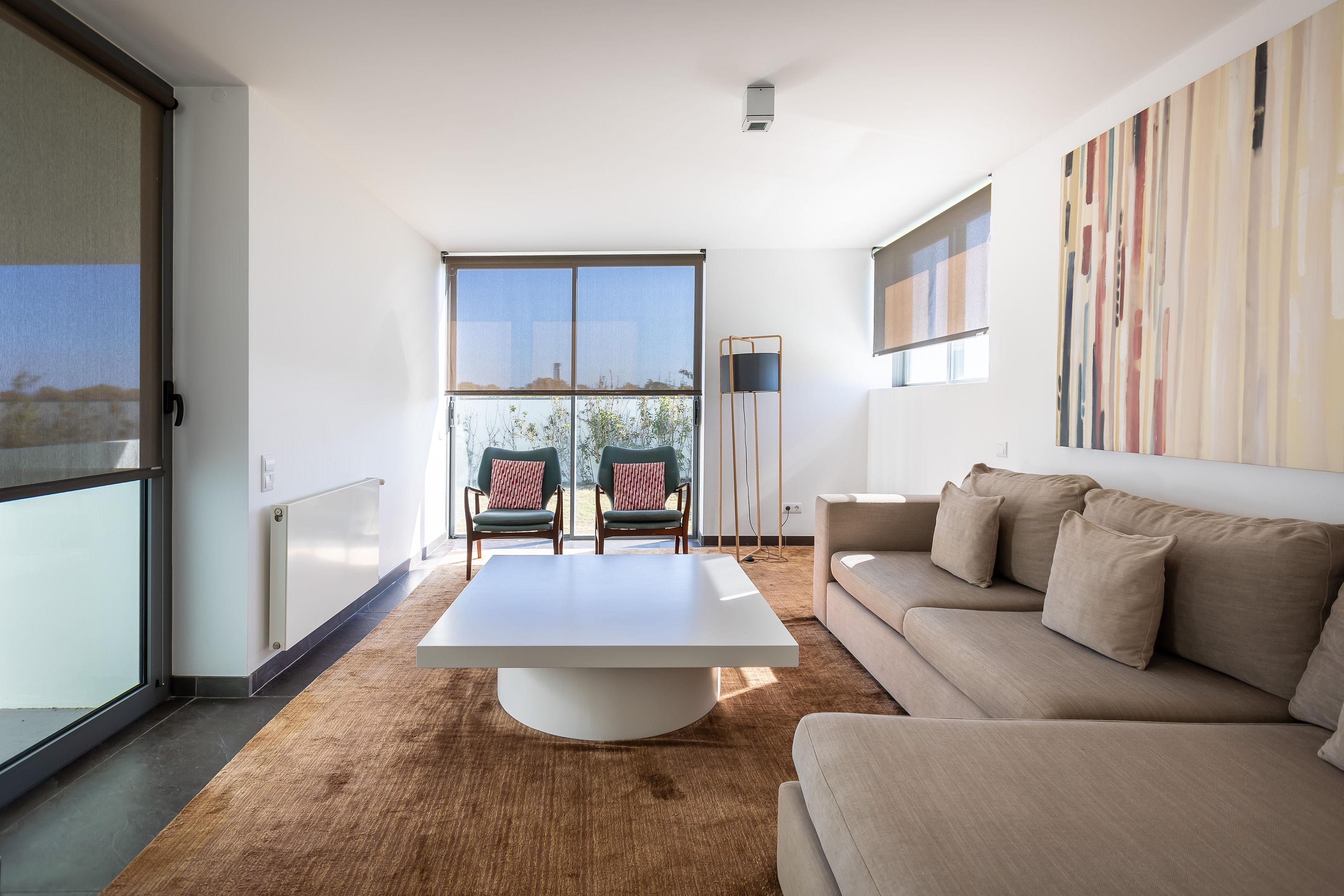 Living room with balcony views as part of a villa at Bom Sucesso Resort