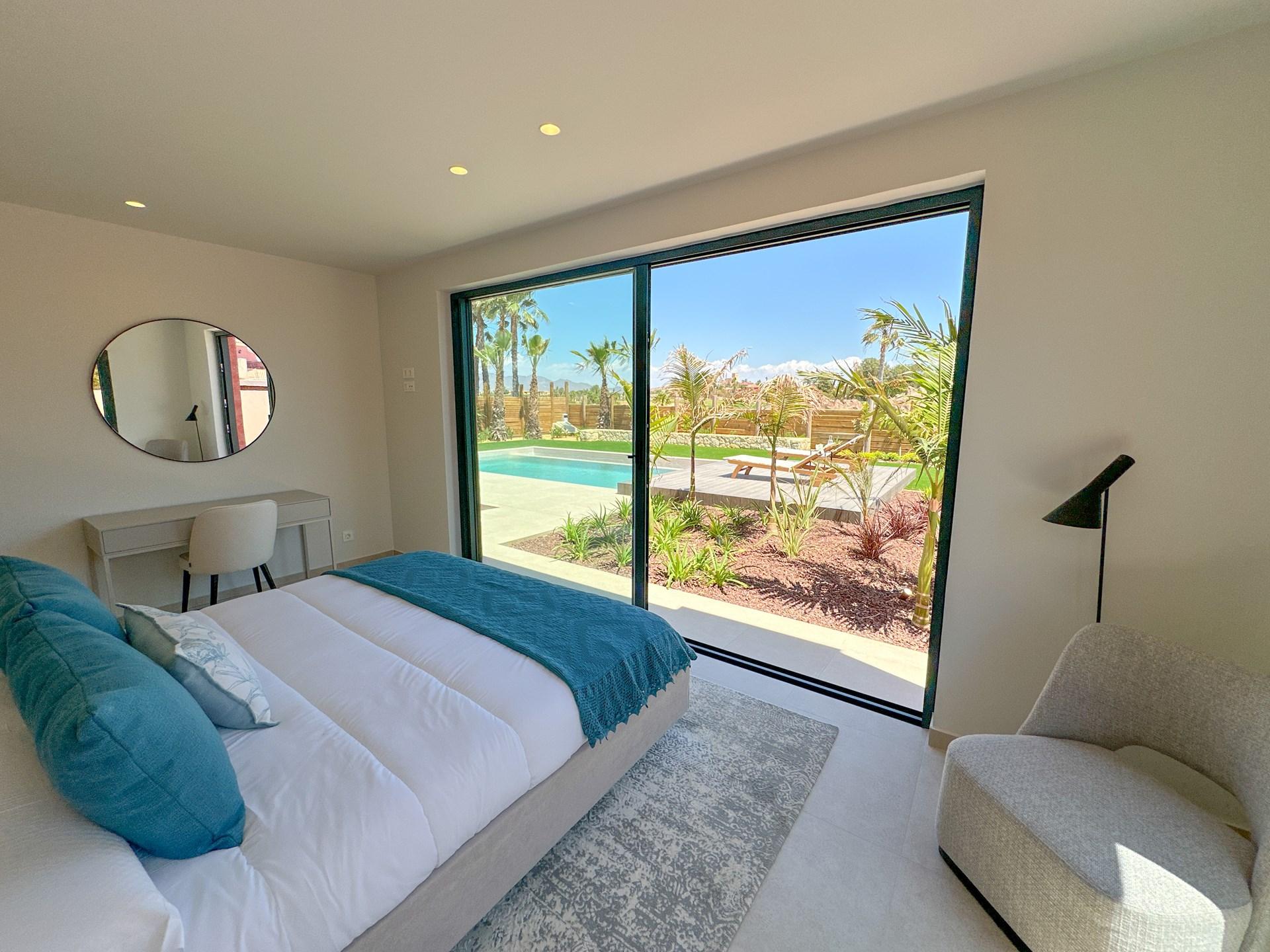Double bed suite as part of a villa with views of an outdoor swimming pool at Desert Springs Resort