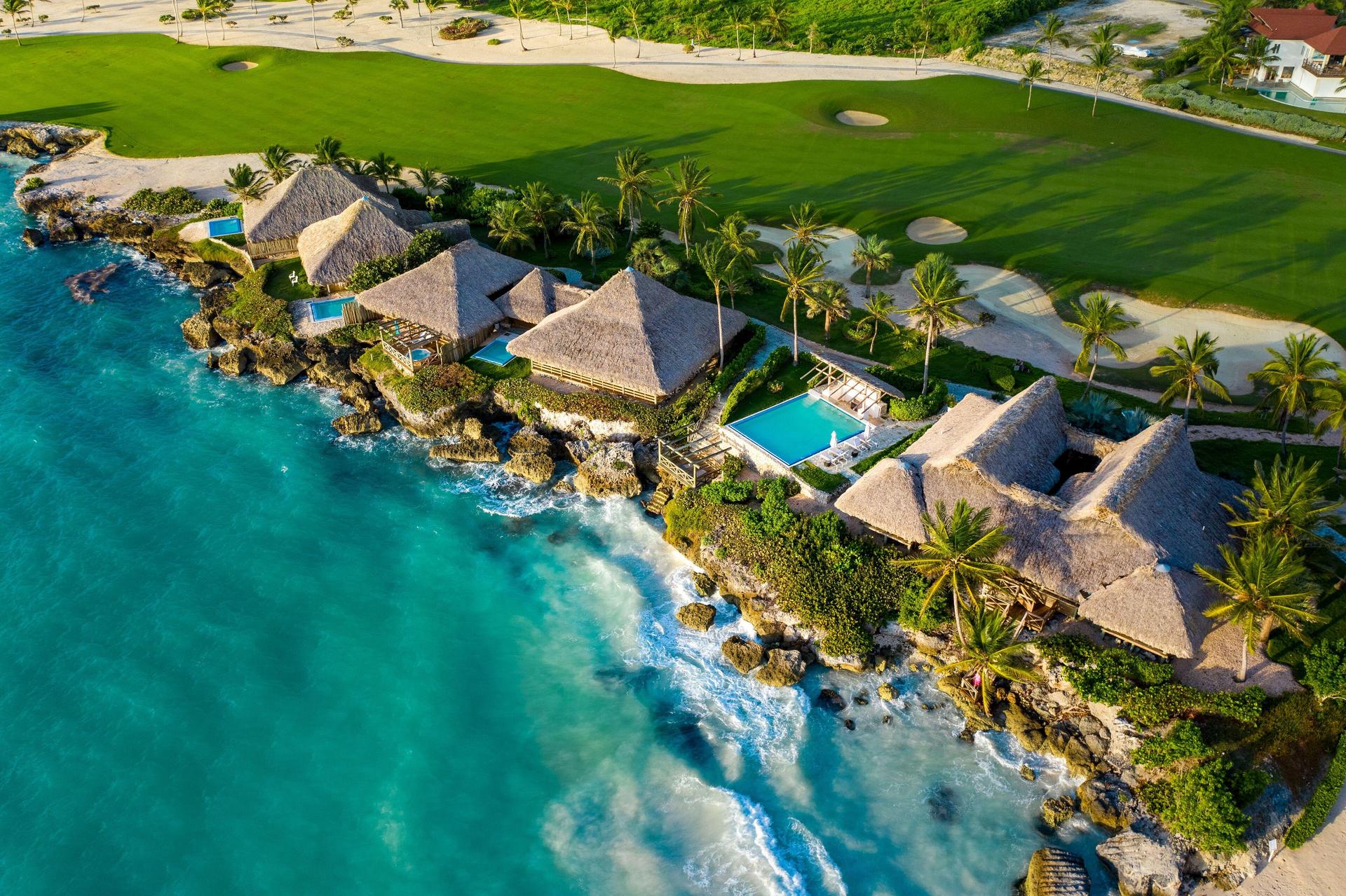 Overhead view of the villas sandwiched between the ocean and golf course