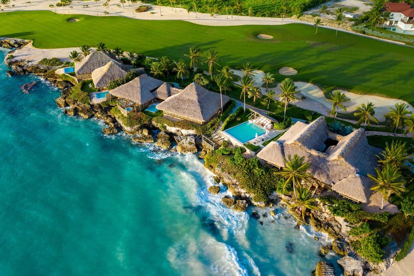 Overhead view of the villas sandwiched between the ocean and golf course