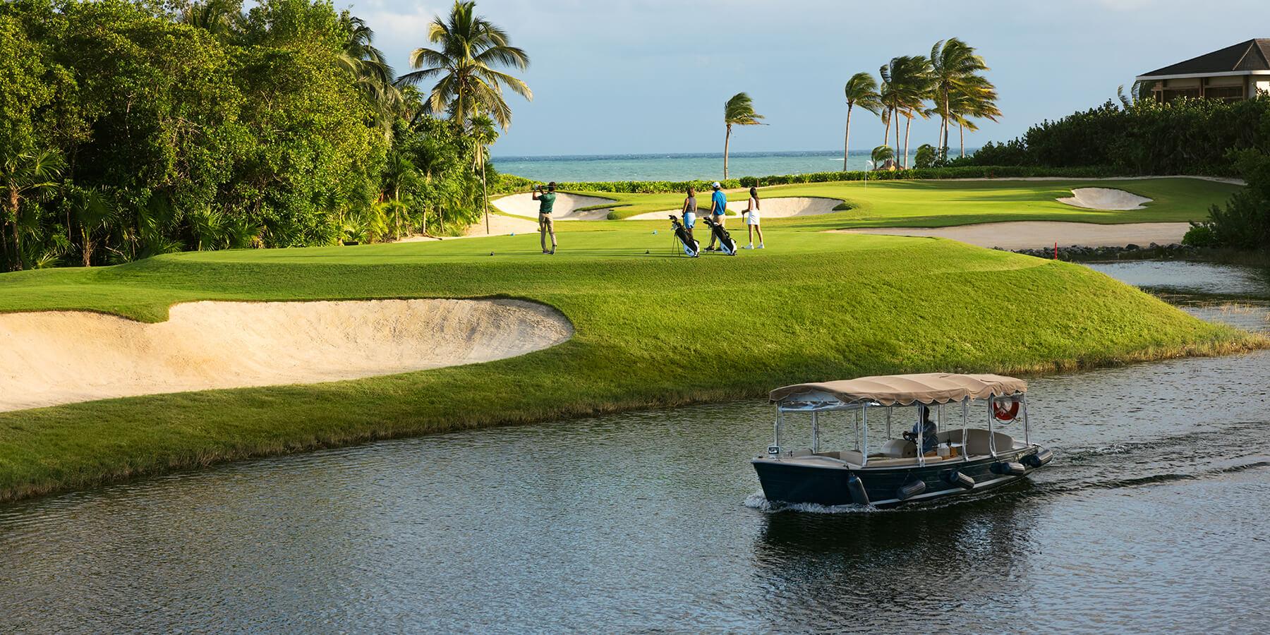 A well maintained fairway nestled with sand bunkers