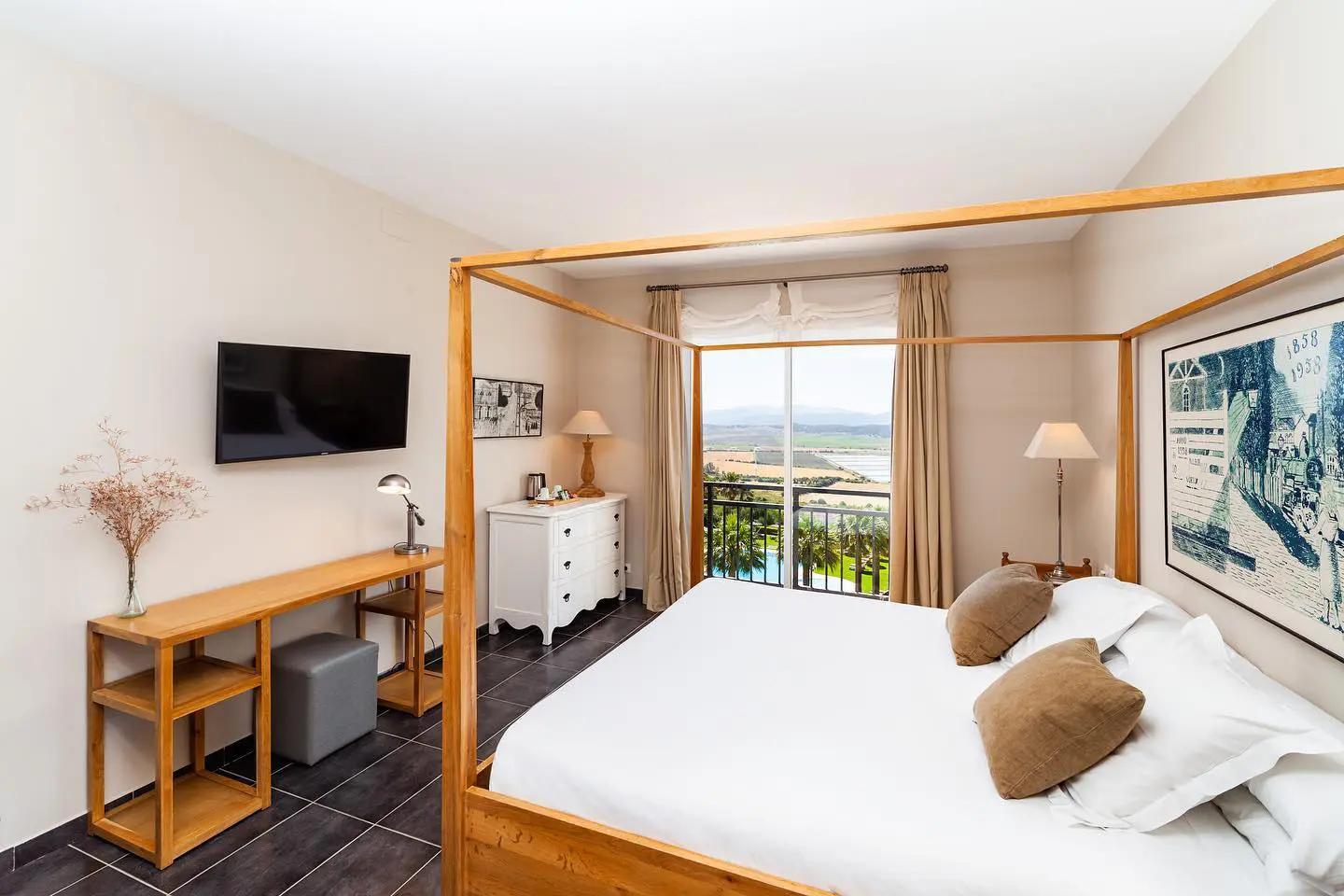 Double bed suite with balcony views at Fairplay Golf & Spa Resort