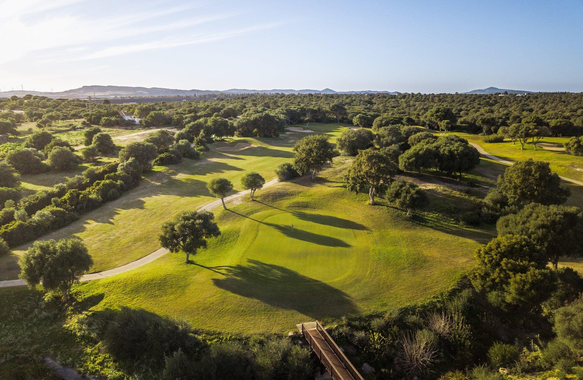 Overhead view of a well maintained fairway leading to a smooth green