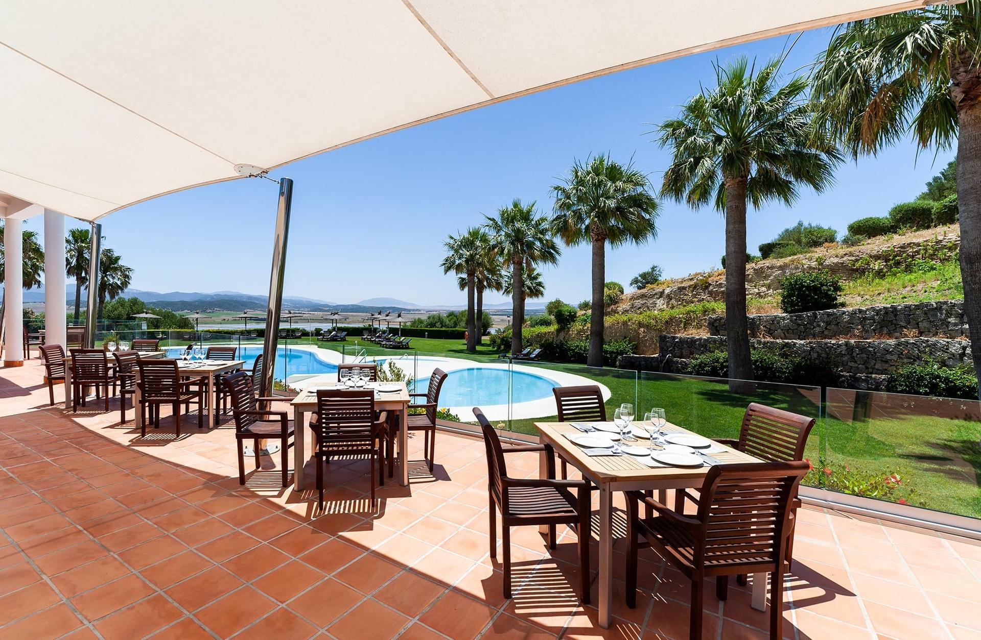 Poolside dining area at Fairplay Golf & Spa Resort