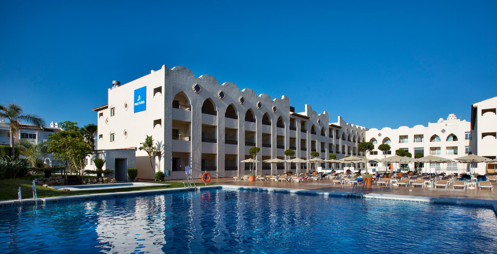 Panoramic view of the Hotel MAC Puerto Marina building overlooking the outdoor pool