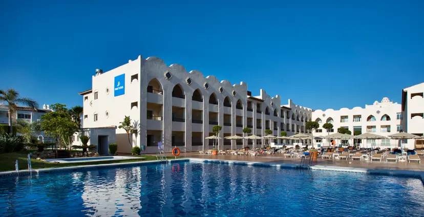 Panoramic view of the Hotel MAC Puerto Marina building overlooking the outdoor pool
