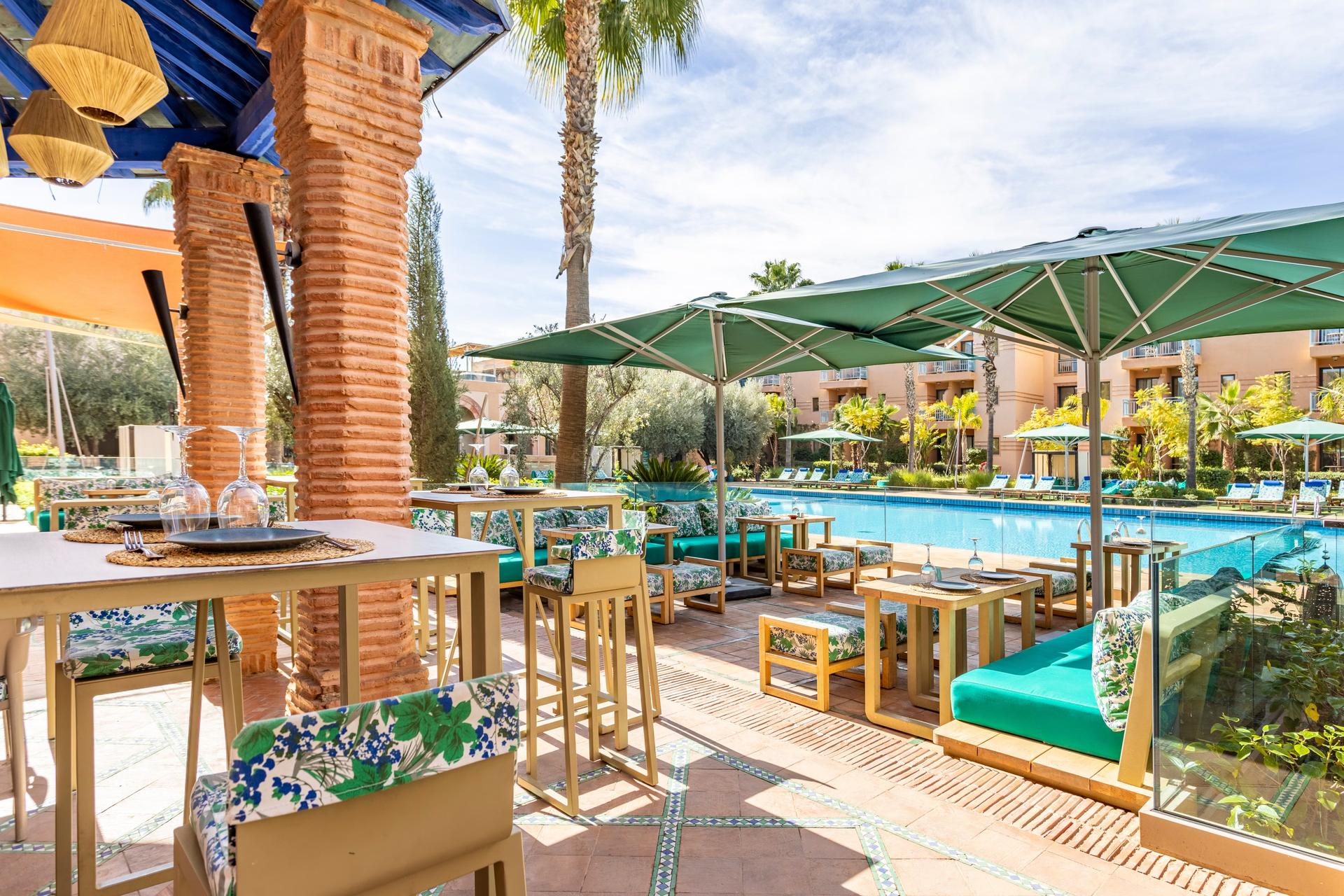 Outdoor swimming pool with a lounging area at Jaal Riad Resort