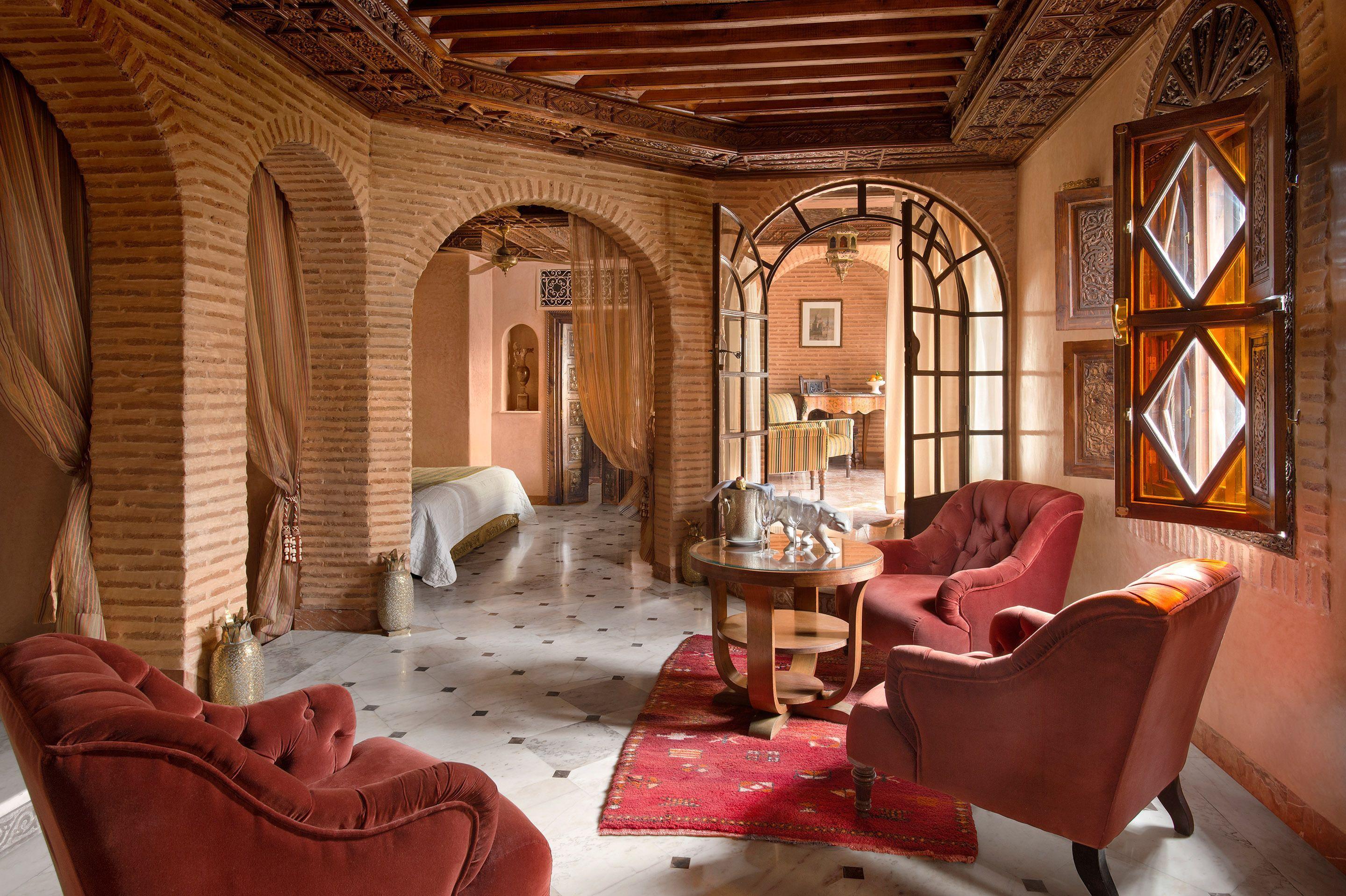 Spacious double bed suite with a lounging ]area at La Sultana Marrakech