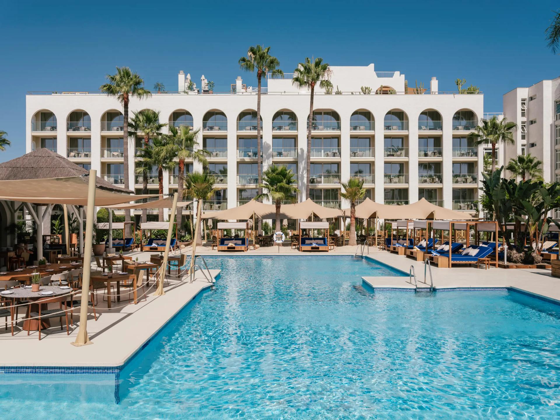 Panoramic view of the ME Marbella building overlooking the outdoor pool