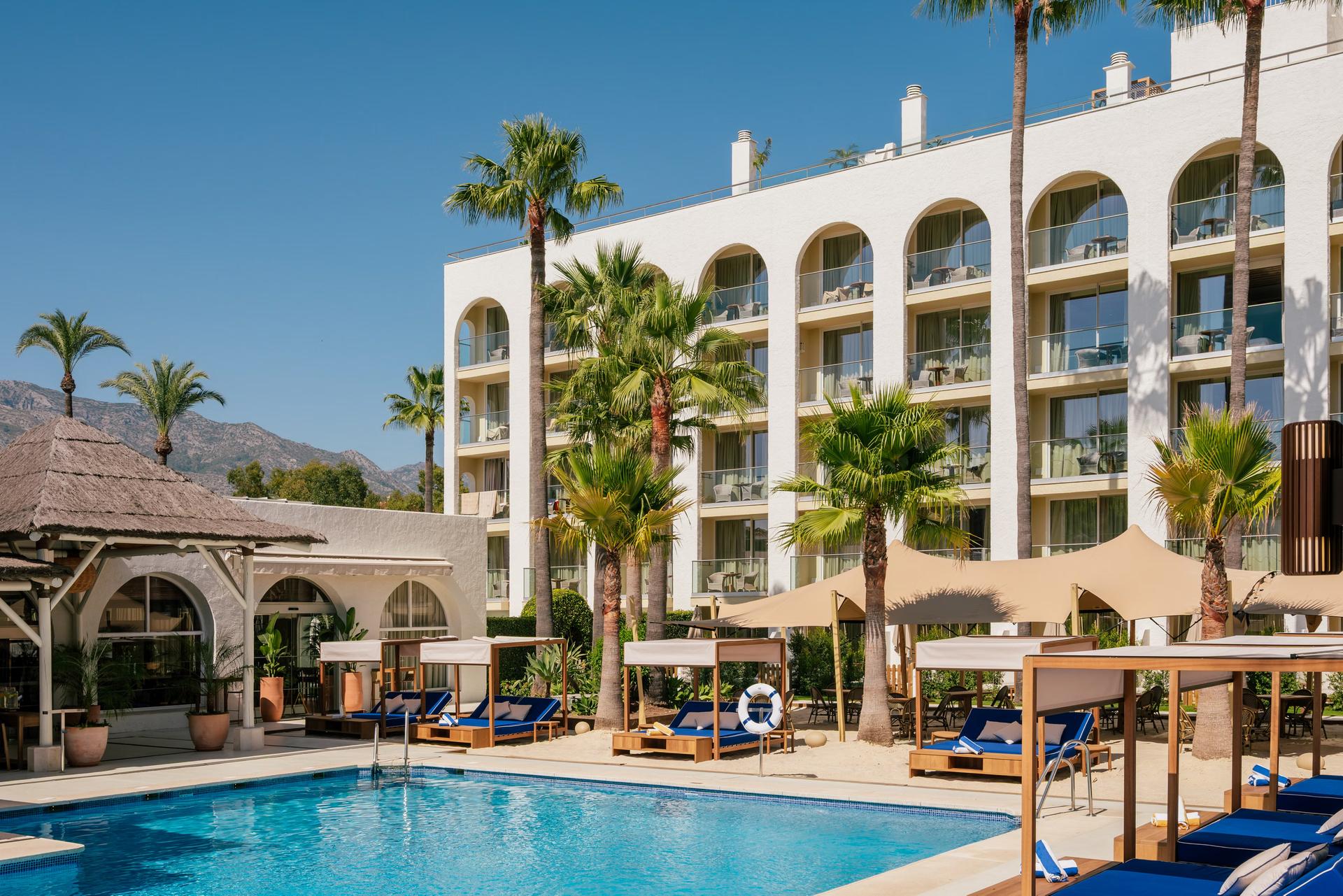 Panoramic view of the ME Marbella building overlooking the outdoor pool