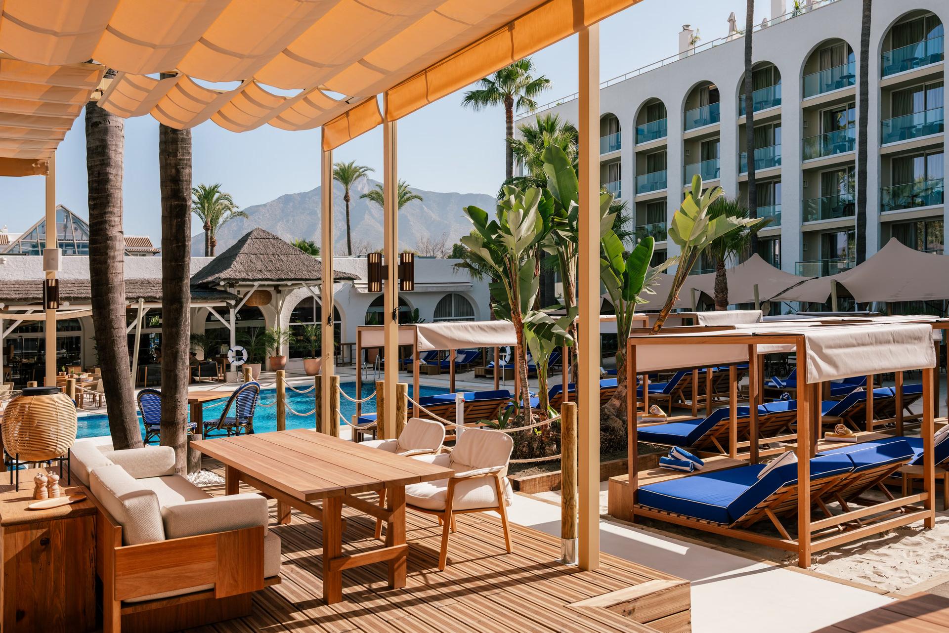 Panoramic view of the ME Marbella building overlooking the outdoor pool