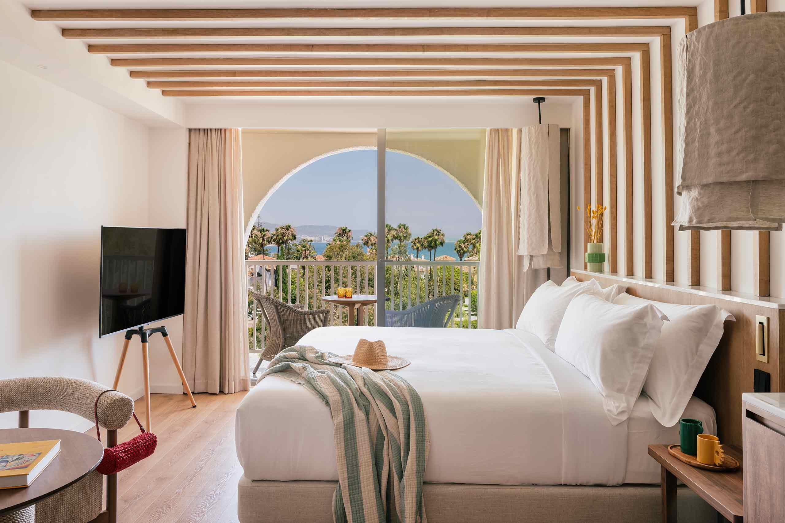 Spacious double bed suite with balcony views at ME Marbella