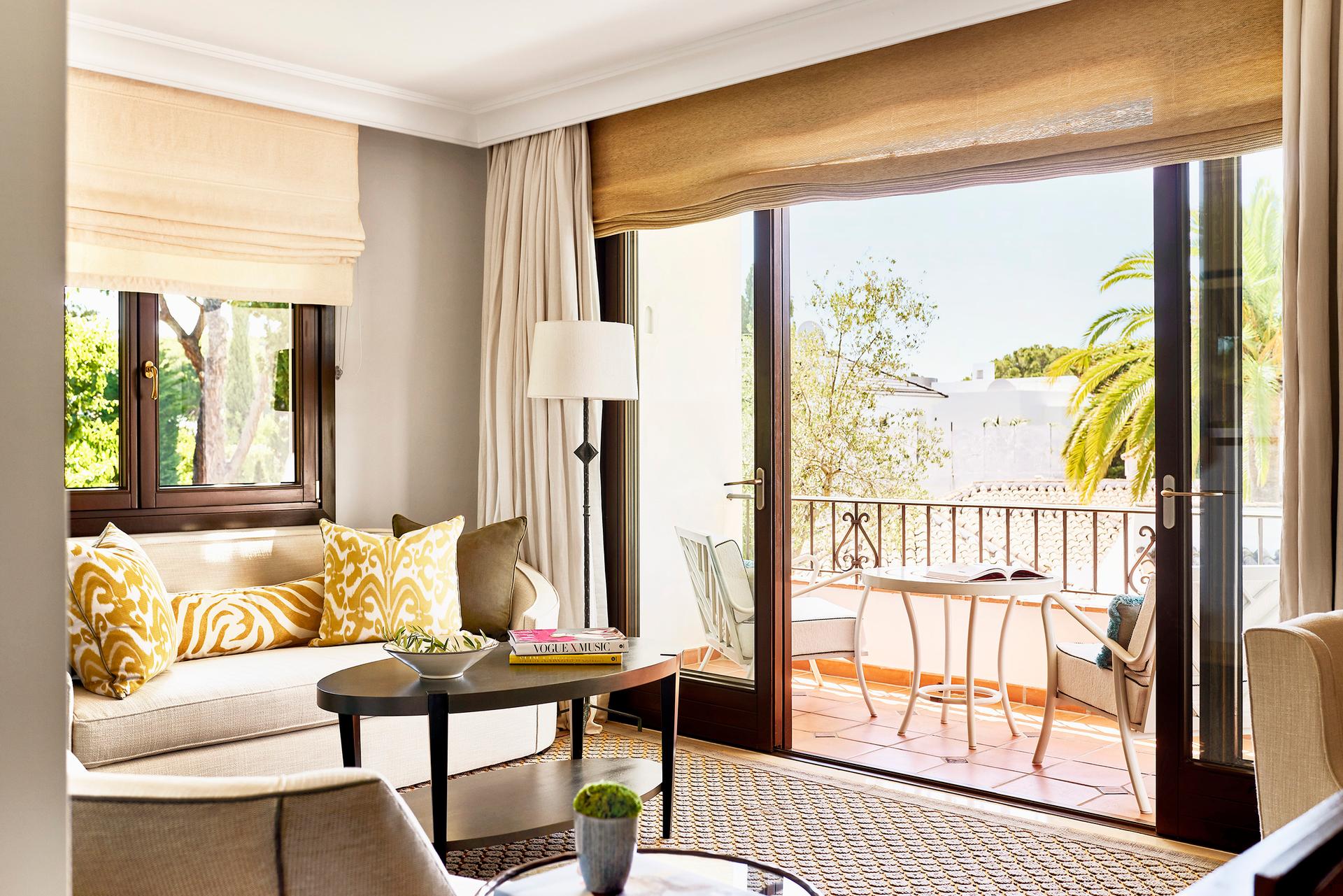 Living room and balcony as part of a suite at Marbella Club Hotel
