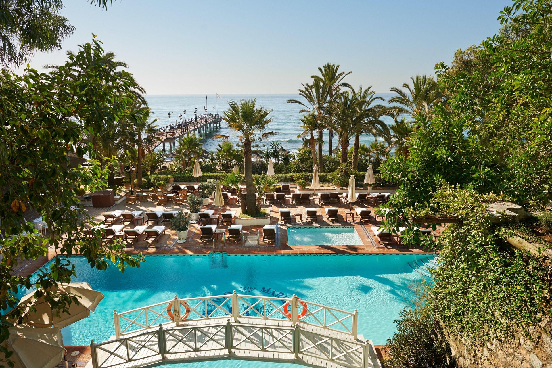Panoramic view of the outdoor swimming pool at Marbella Club Hotel