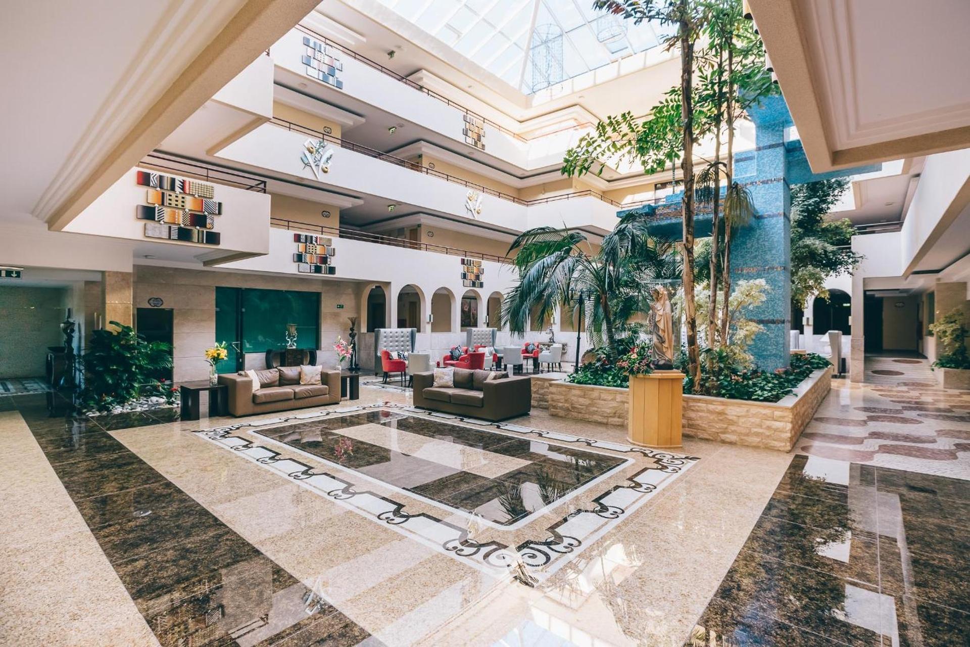 Indoor lobby and lounging area at Muthu Forte da Oura