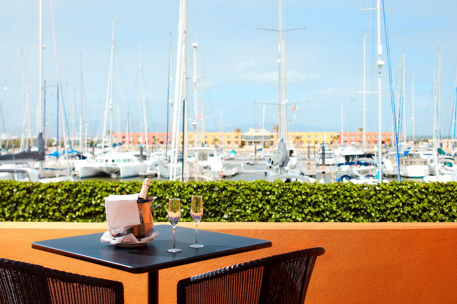 Outdoor dining area with views of the dock