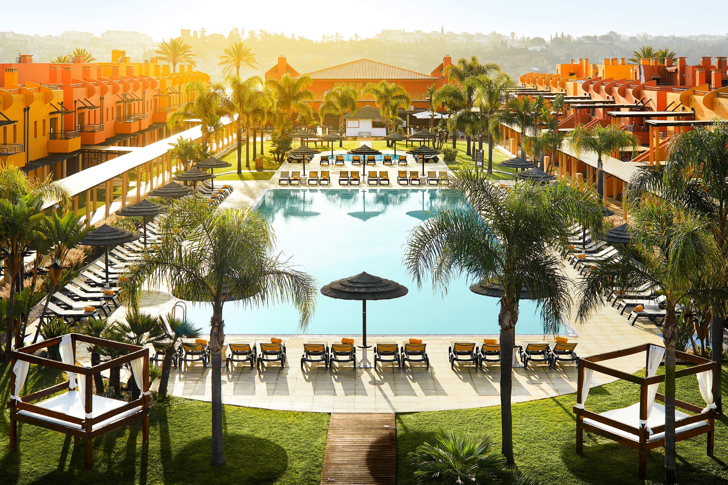 Overhead view of the outdoor swimming pool at NH Marina Portimão