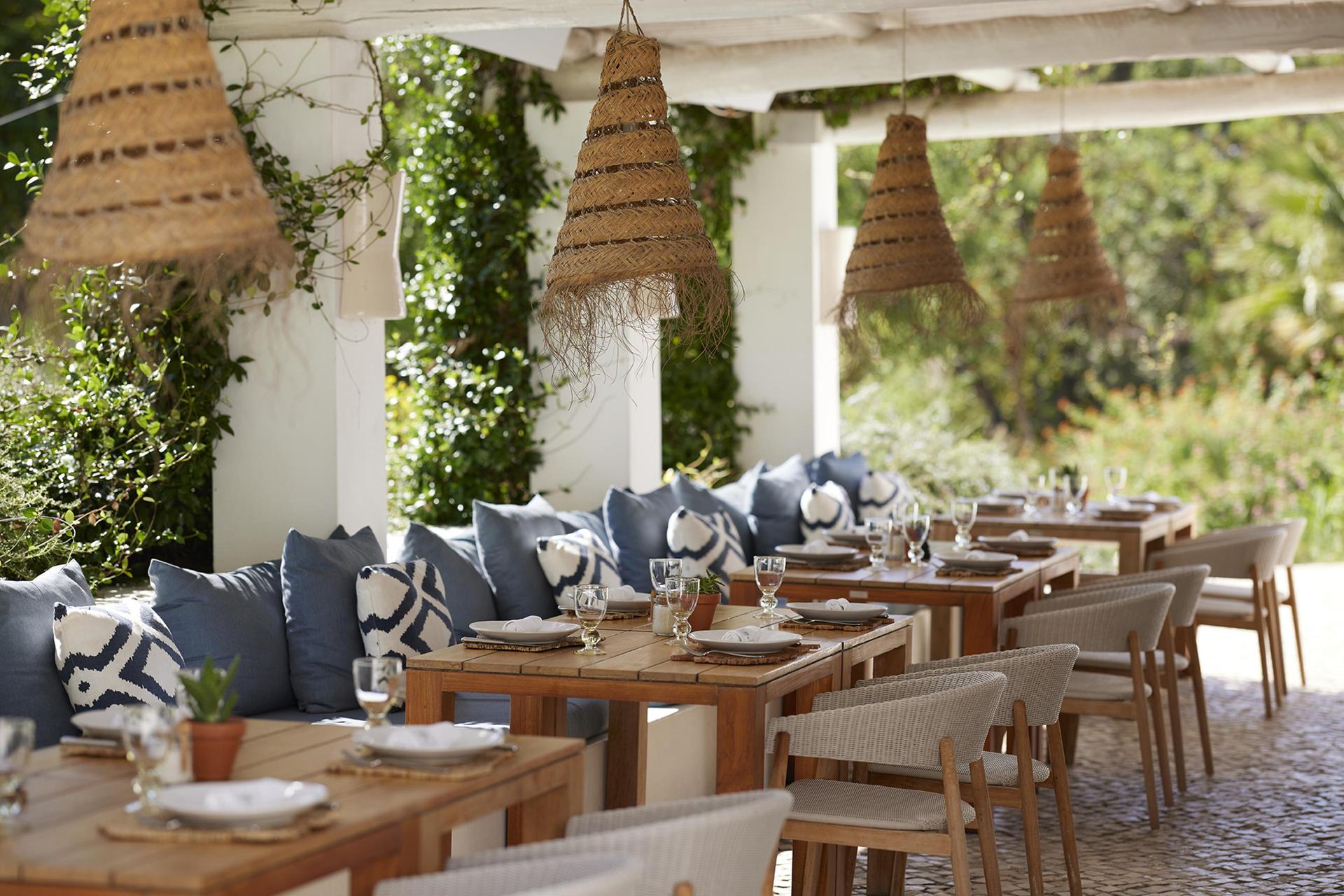 Outdoor dining area at Octant Hotel Vila Monte