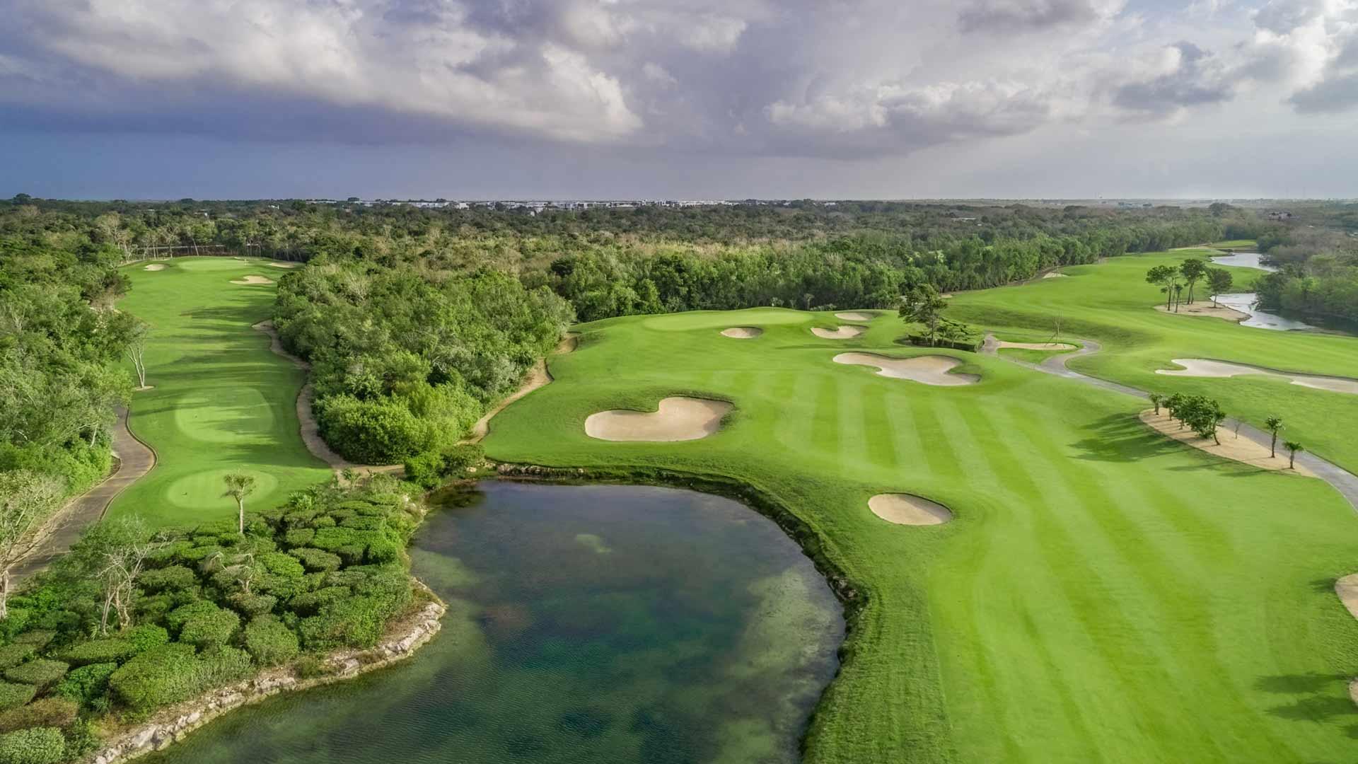 Overhead view of a well maintained fairway nestled with sand bunkers