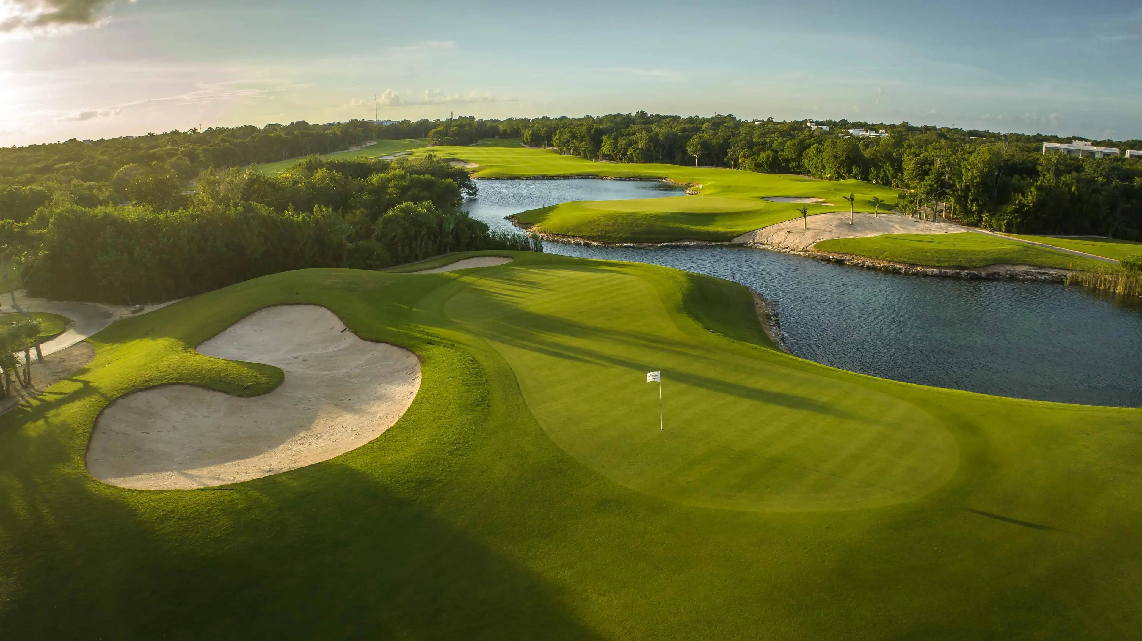 Overhead view of a smooth green next to a large sand bunker