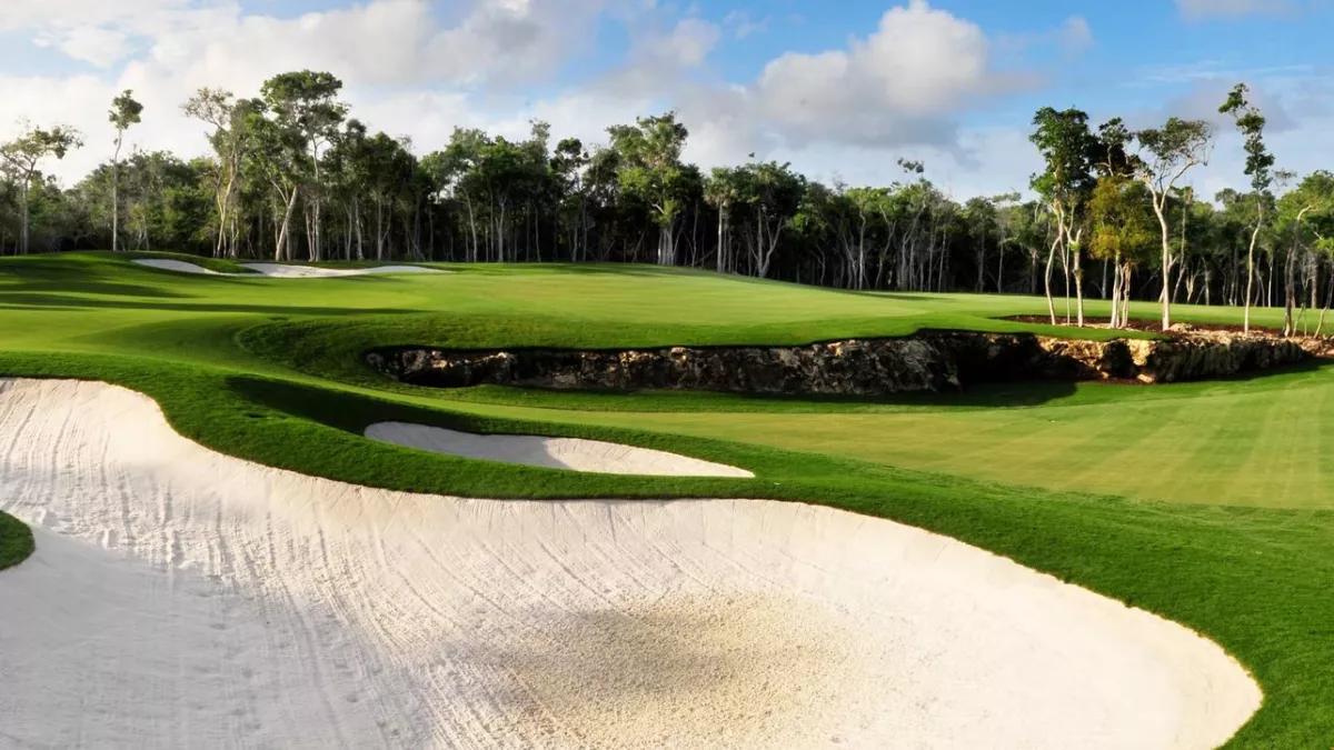 Overhead view of a smooth green nestled with sand bunkers