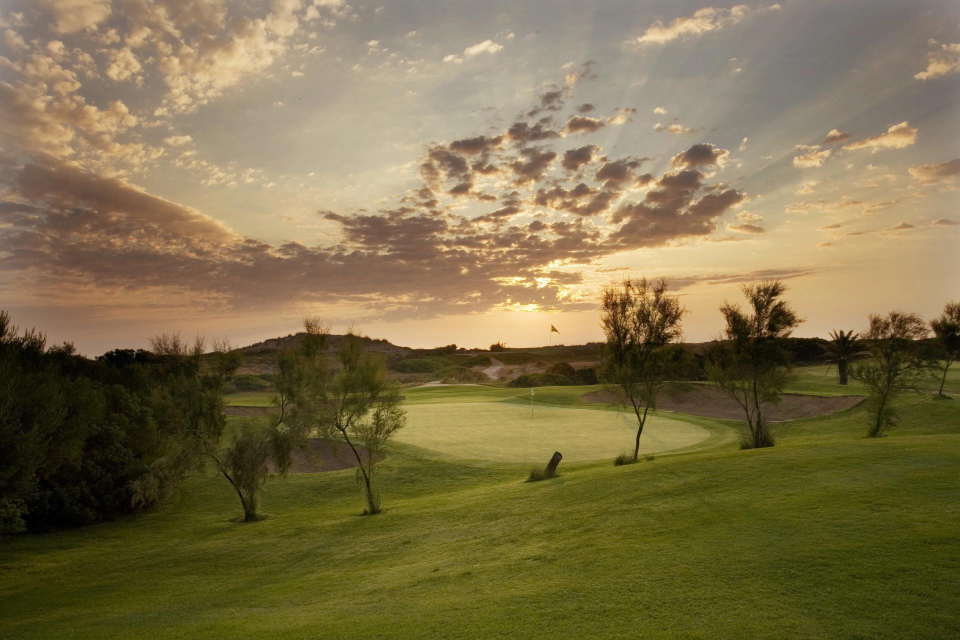 A well maintained fairway leading to a smooth green at Parador El Saler