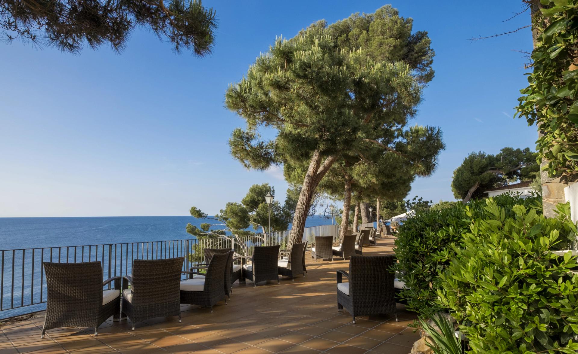 Outdoor lounging area with coastal views