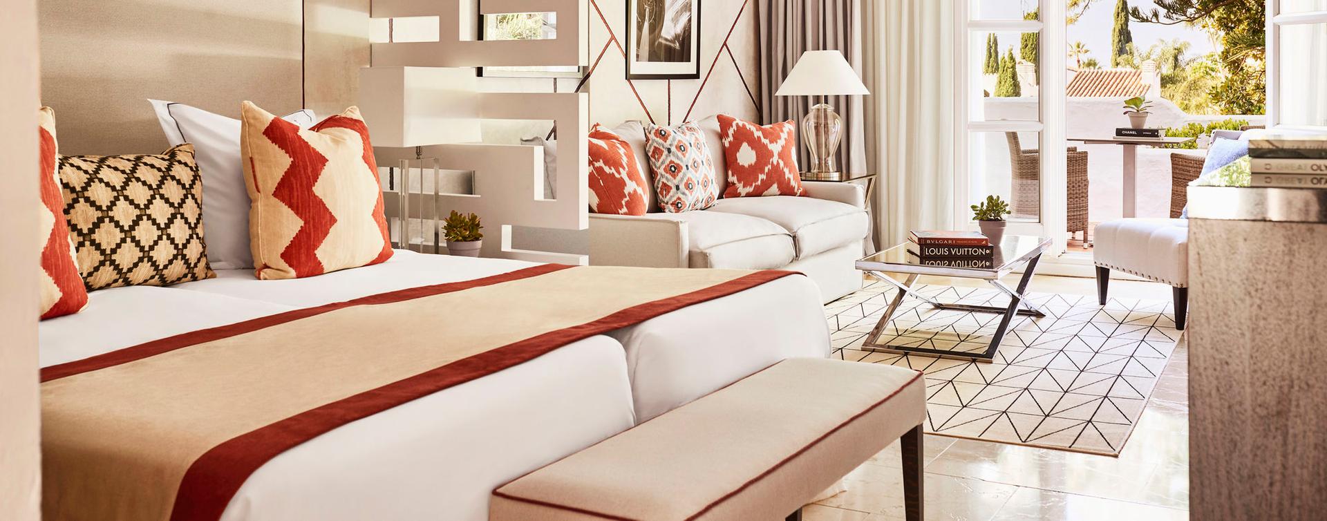 Double bed suite with a patio space at Puente Romano Beach Resort