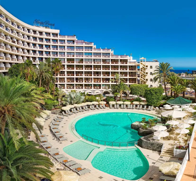 Panoramic view of the Seaside Sandy Beach hotel overlooking the outdoor pool