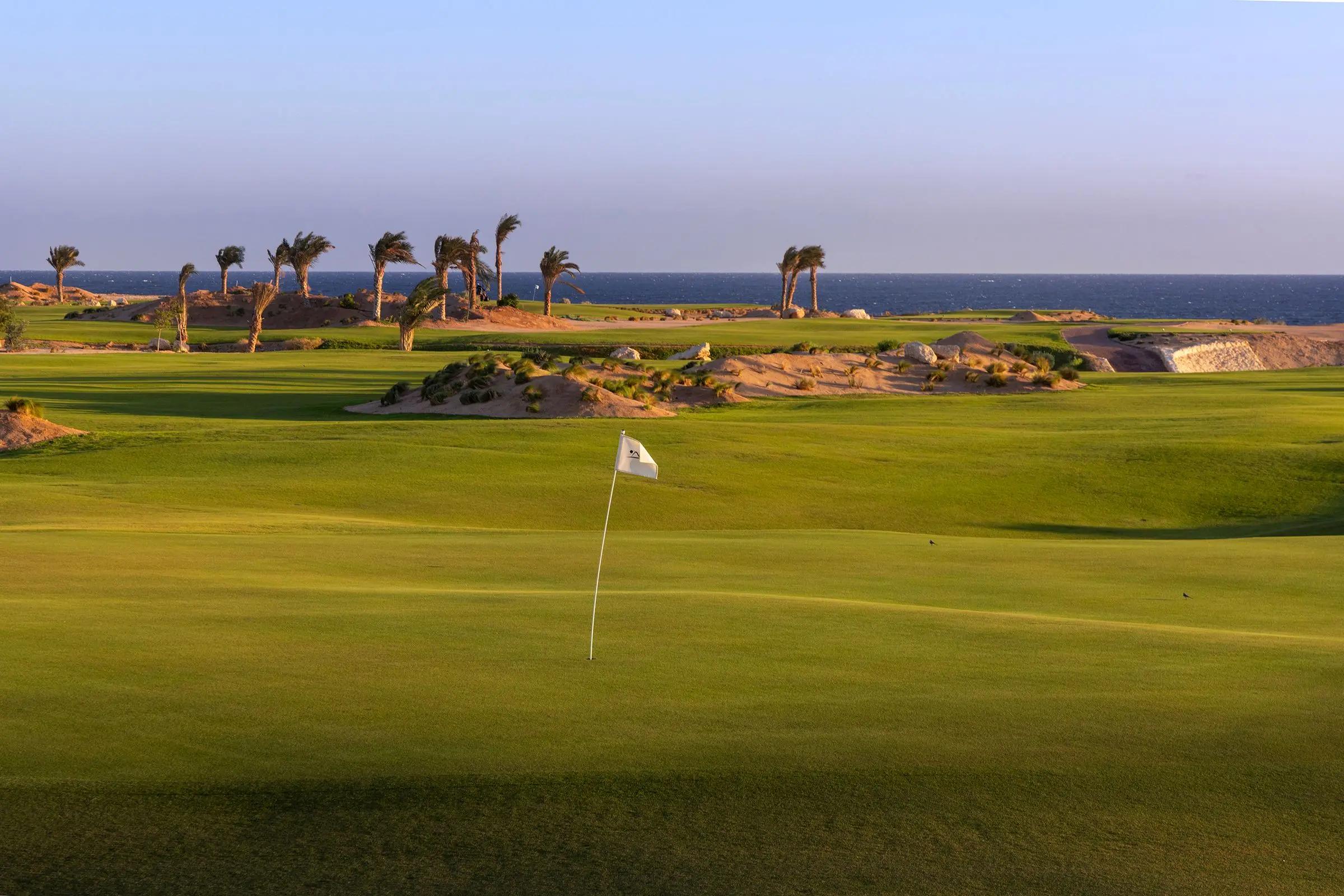 A well maintained fairway leading to a smooth green