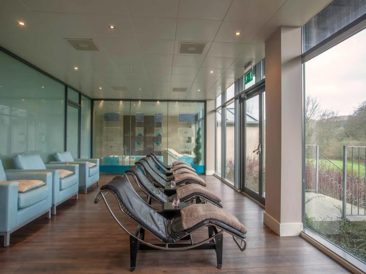 Indoor pool and sunbeds as part of the spa facilities at Castle Dargan Golf Hotel