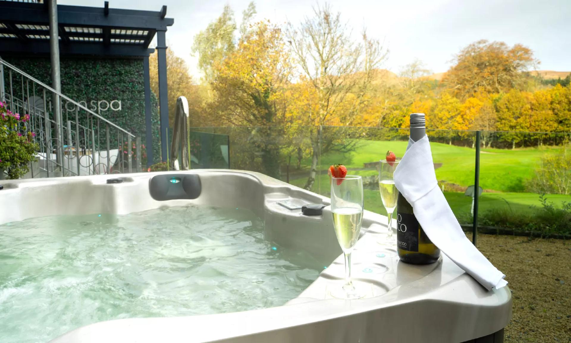 Outdoor jacuzzi with views of the golf course at Castle Dargan Golf Hotel