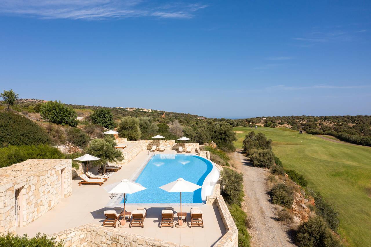 Overhead view of the outdoor swimming pool at Crete Golf Club & Hotel
