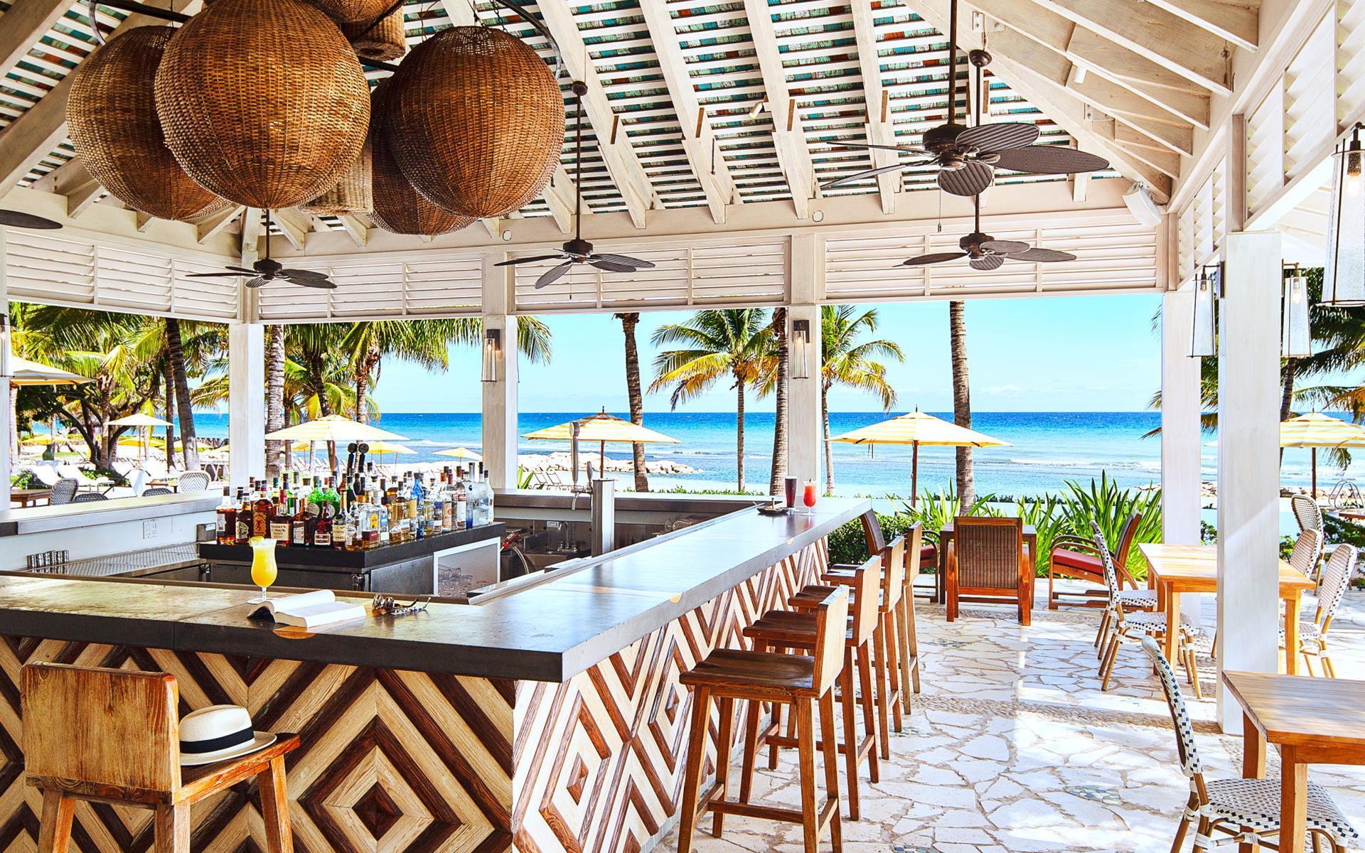 Outdoor bar and dining area at Half Moon