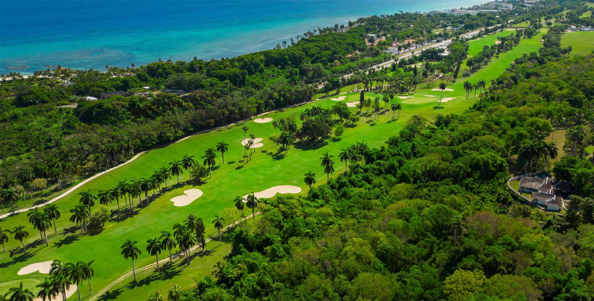 Overhead view of a well maintained fairway nestled with sand bunkers
