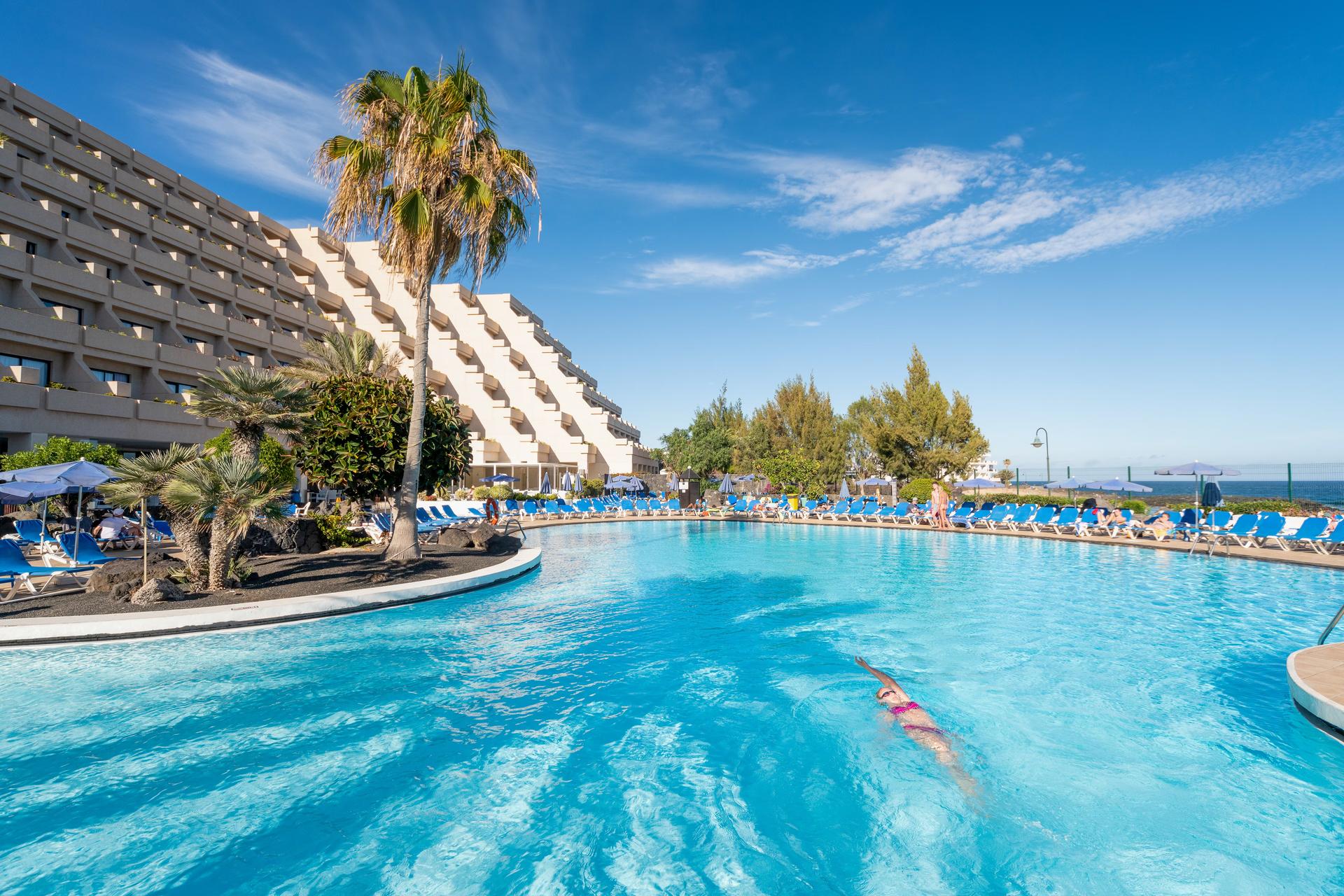 The Alexandre Teguise Playa building overlooking the outdoor pool at Alexandre Teguise Playa
