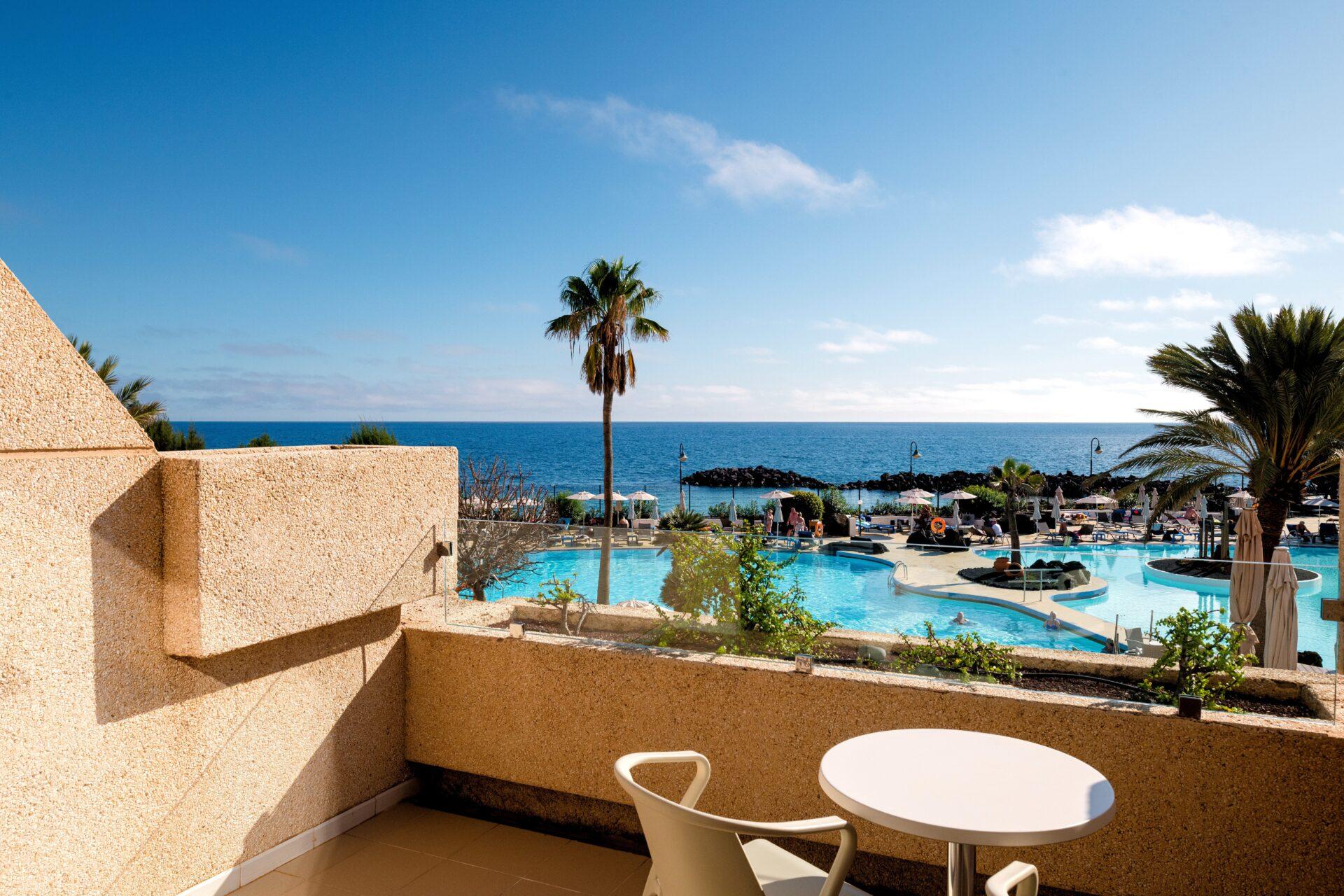 Balcony views of the outdoor pool at Alexandre Teguise Playa