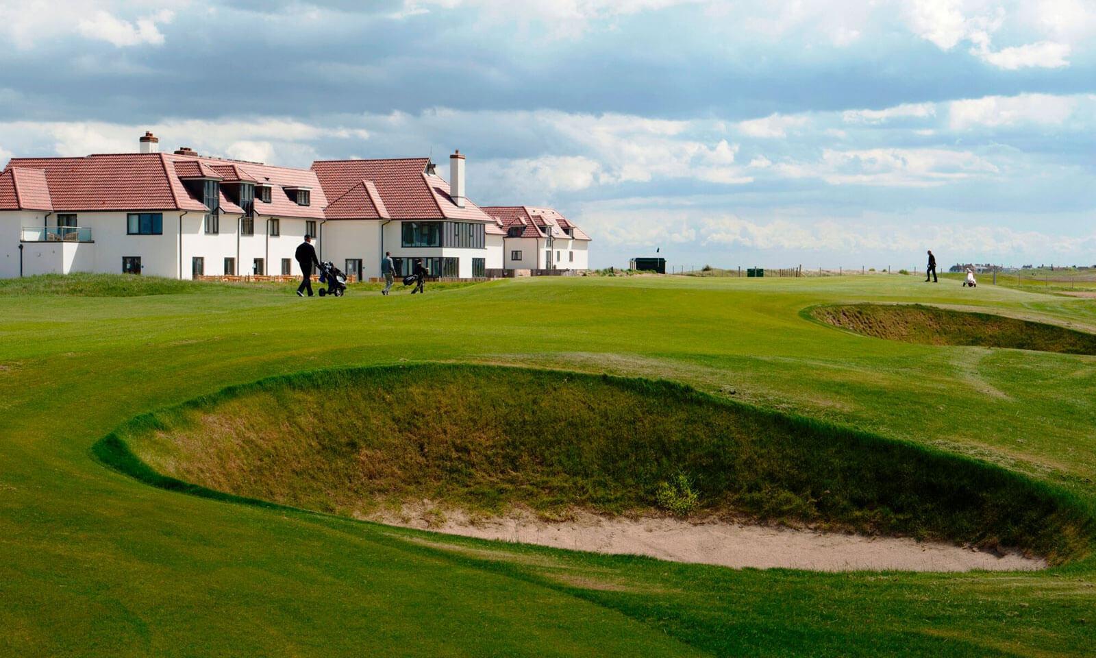 Panoramic view of the Prince's Golf Club building overlooking and outdoor sand bunker