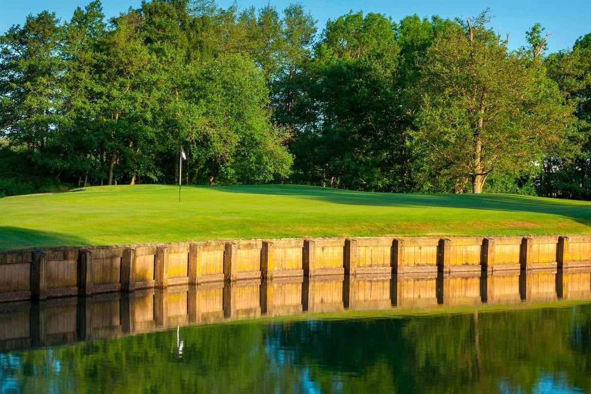 A smooth green next to a water hazard