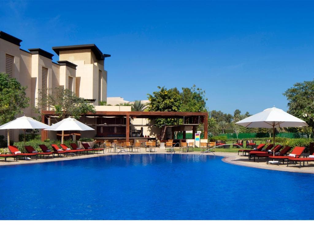 Outdoor swimming pool at VOGO Abu Dhabi Golf Resort & Spa