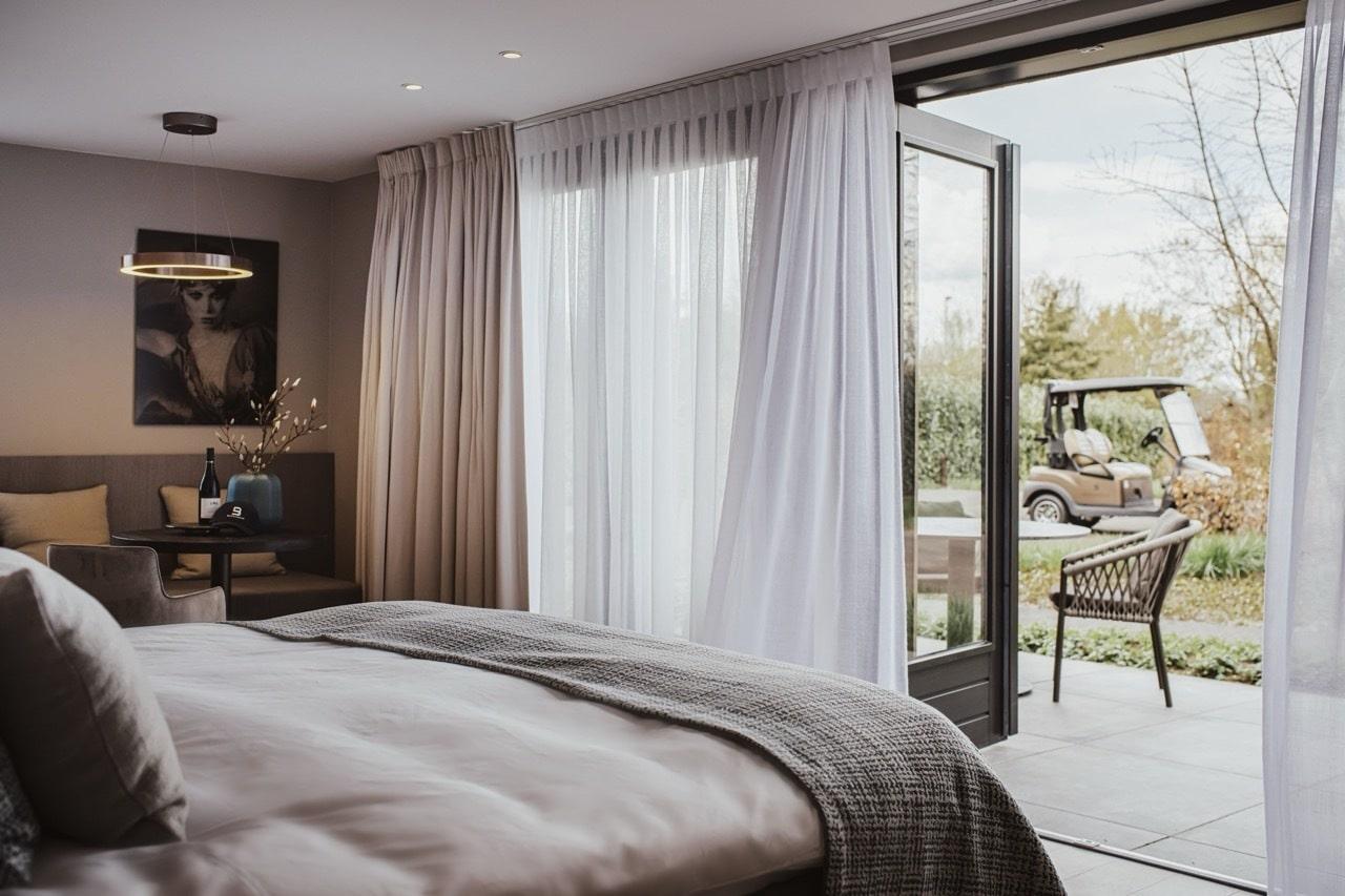 Double bed room with patio space at the Bernardus Lodge