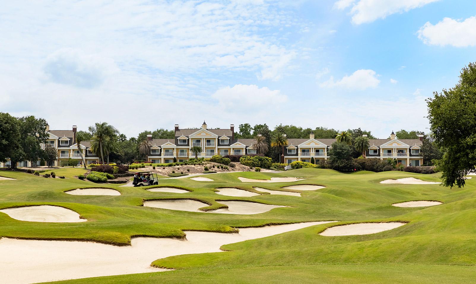 A well maintained fairway littered with sand bunkers at the Reunion Resort