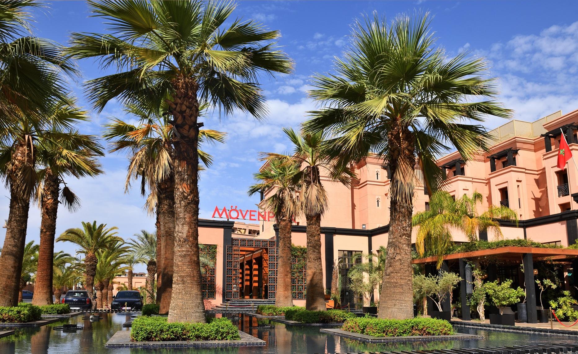 Front entrance to the Movenpick Mansour Eddahbi Hotel with palm trees